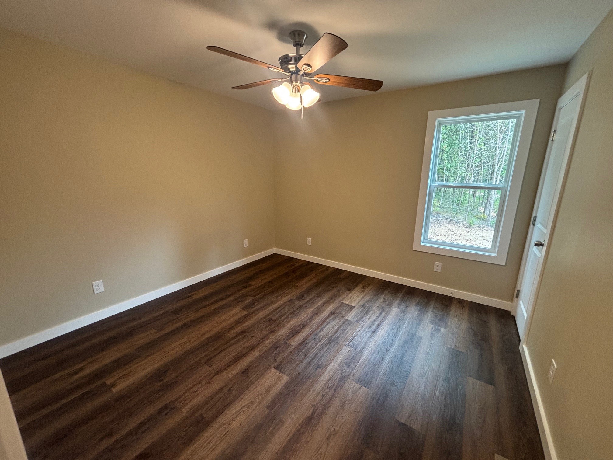 2303 Charley Davis Road Goodspring, TN 38460 - Photo 14 of 16 a view of wooden floor and a chandelier fan in a room