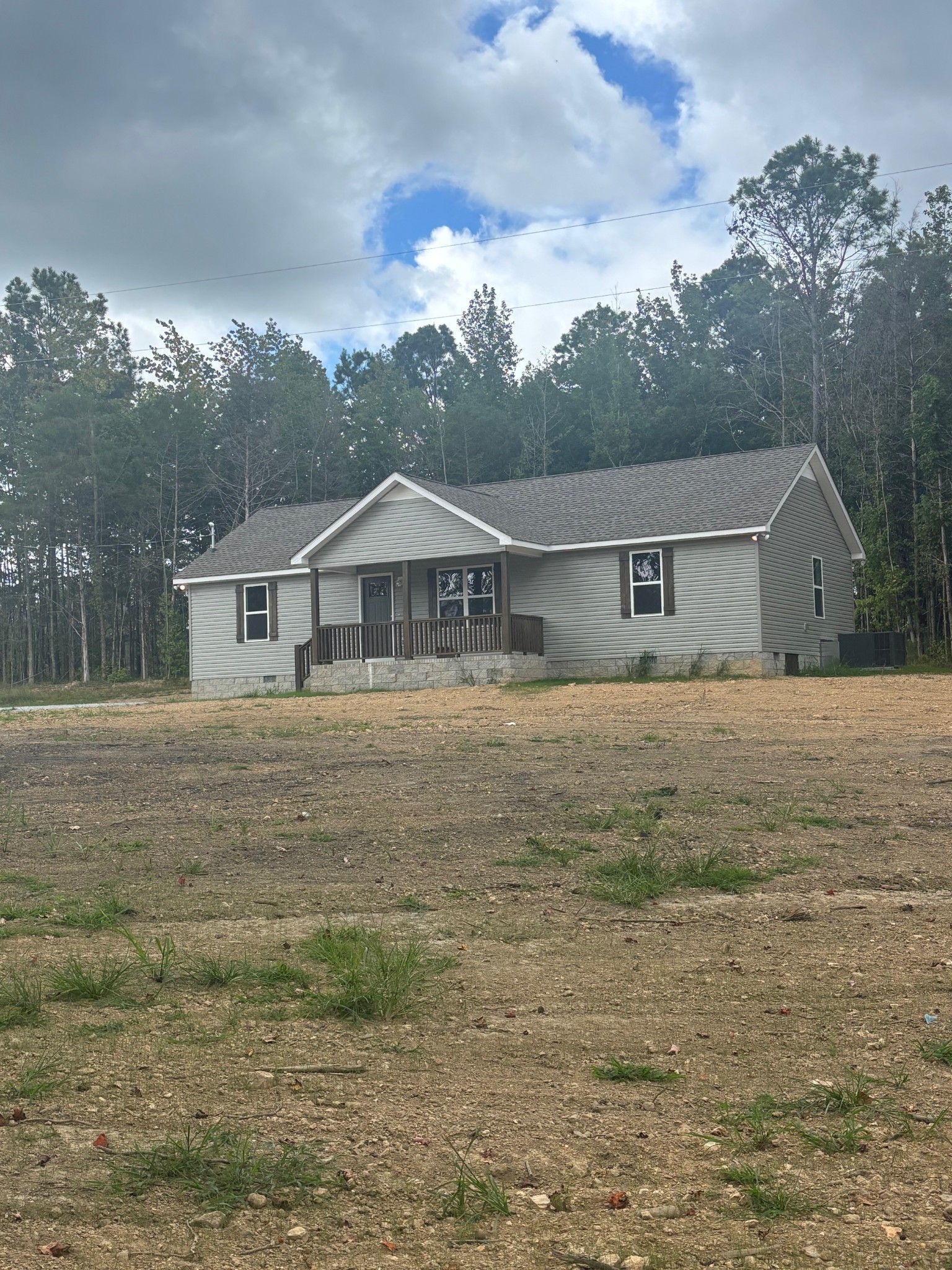 2303 Charley Davis Road Goodspring, TN 38460 - Photo 4 of 16 a front view of a house with a yard