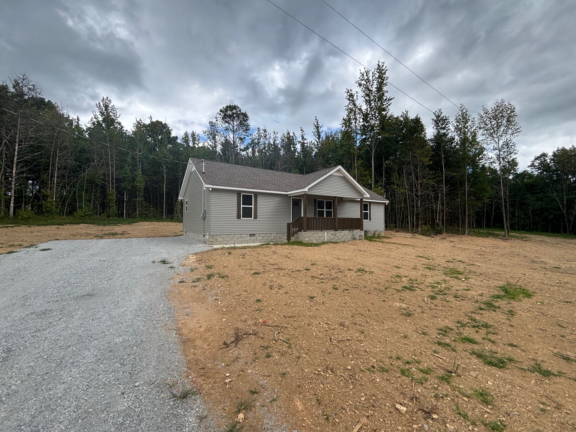 2303 Charley Davis Road Goodspring, TN 38460 - Photo 5 of 16 a view of house with backyard and trees