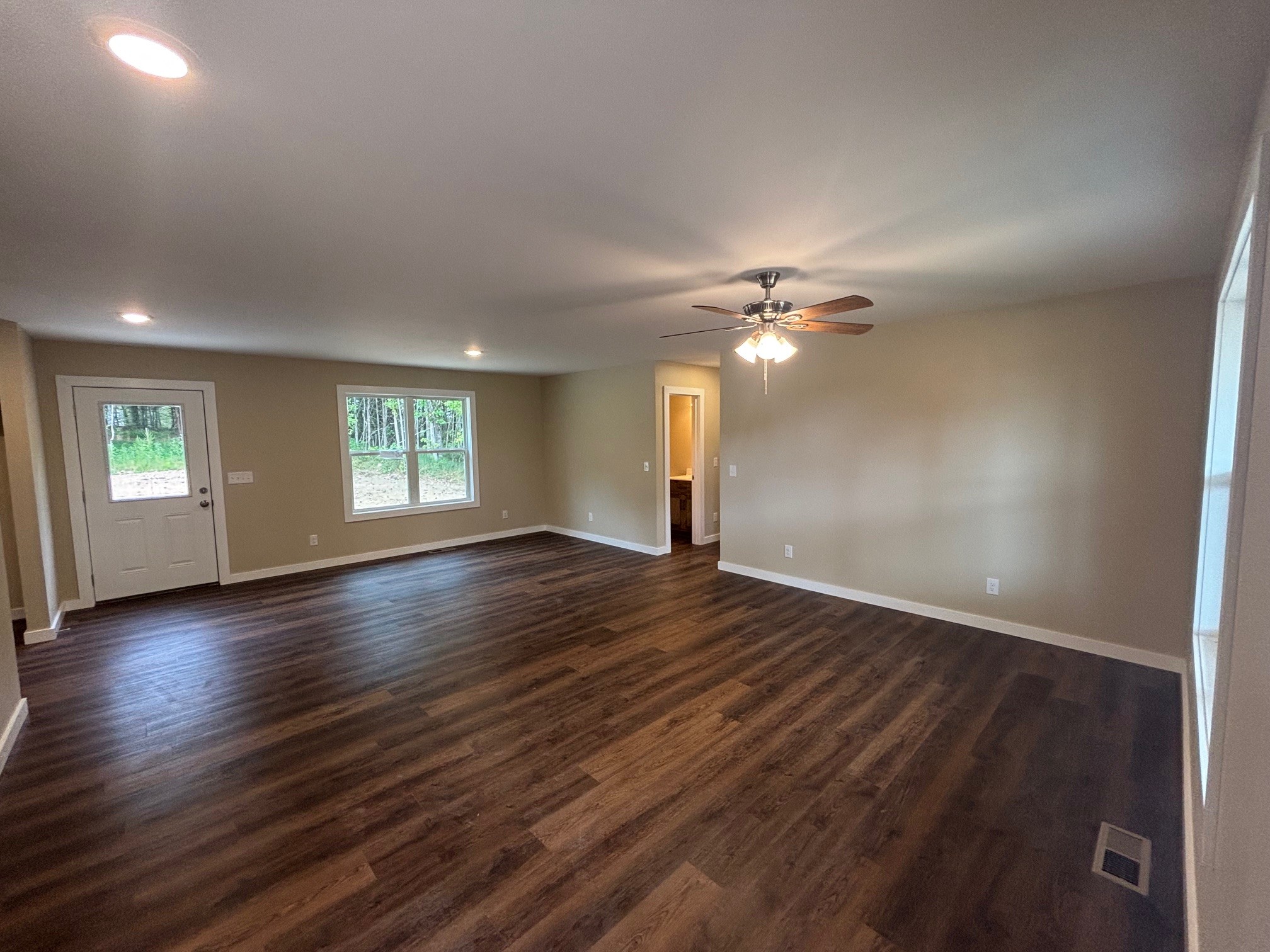 2303 Charley Davis Road Goodspring, TN 38460 - Photo 8 of 16 a view of a livingroom with wooden floor and a window