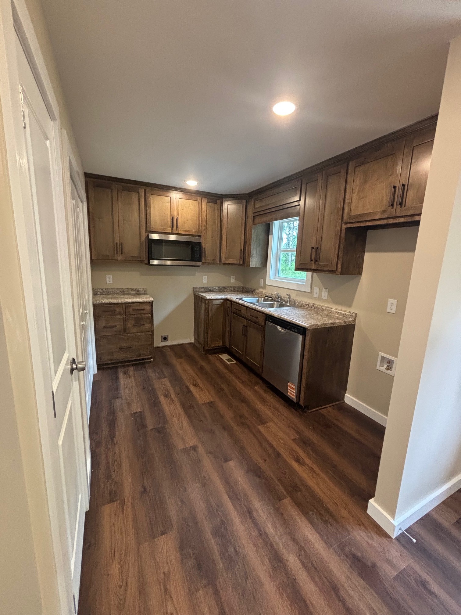 2303 Charley Davis Road Goodspring, TN 38460 - Photo 9 of 16 a kitchen with a sink and wooden floor