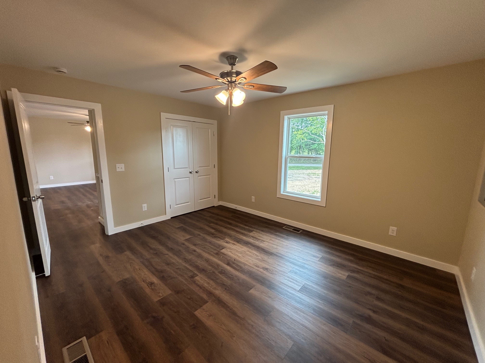 2303 Charley Davis Road Goodspring, TN 38460 - Photo 10 of 16 a view of empty room with wooden floor and fan