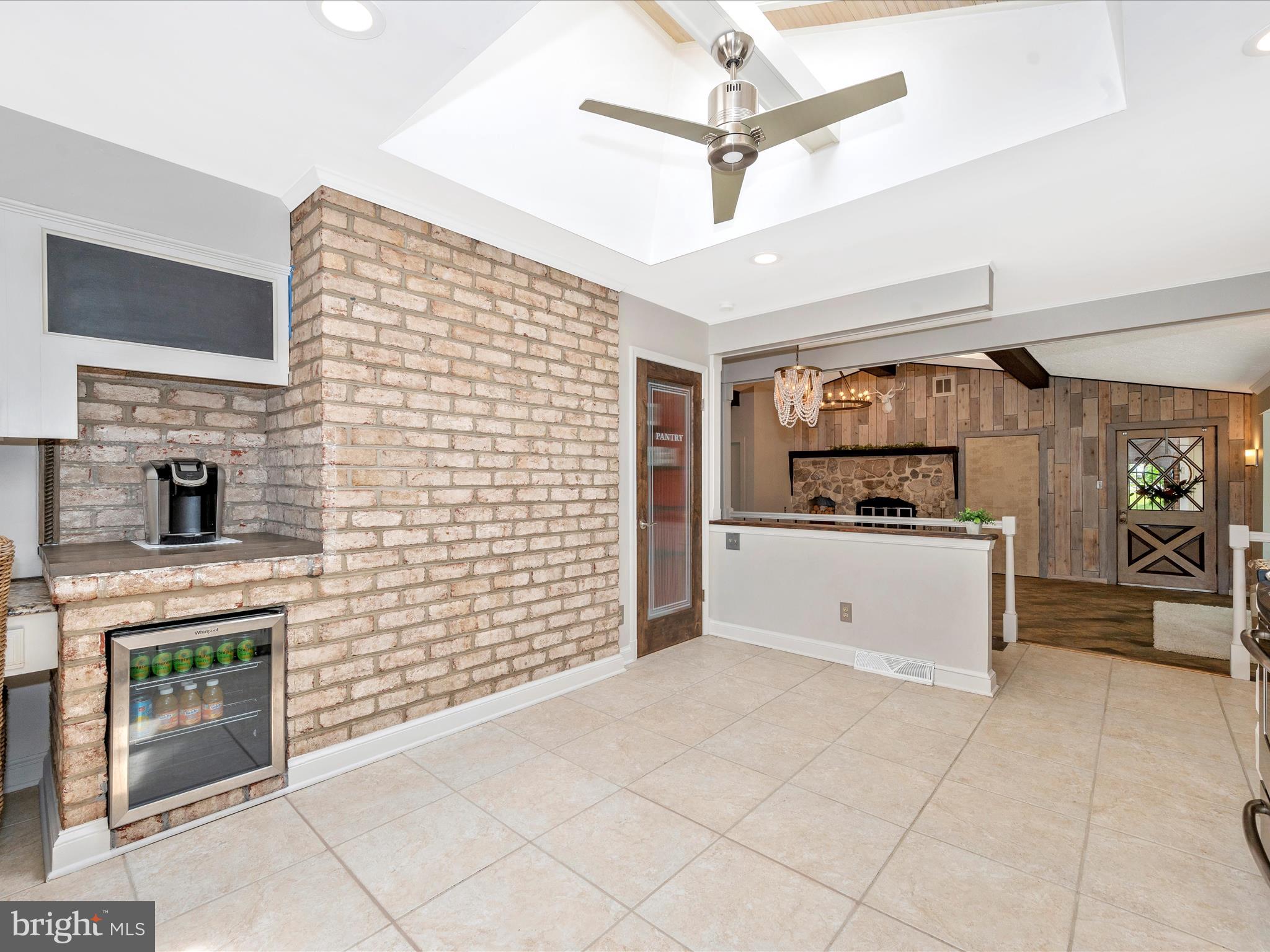 4414 Pinetree Road Rockville, MD 20853 - Photo 26 of 51 wine fridge, exposed brick