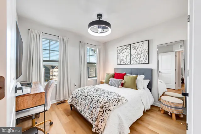 a bedroom with a bed and a table with chair