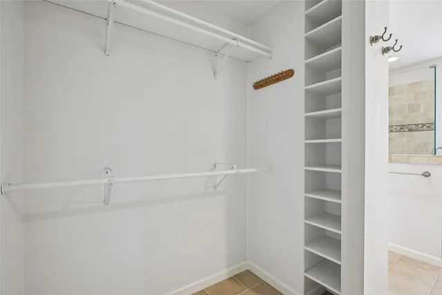 a view of an empty walk in closet