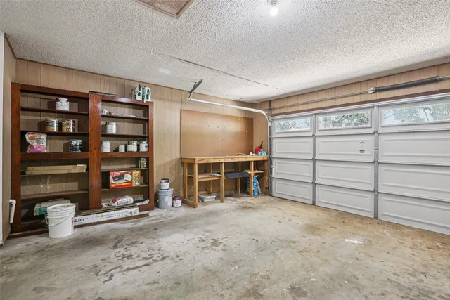 a view of an empty room with storage and utility