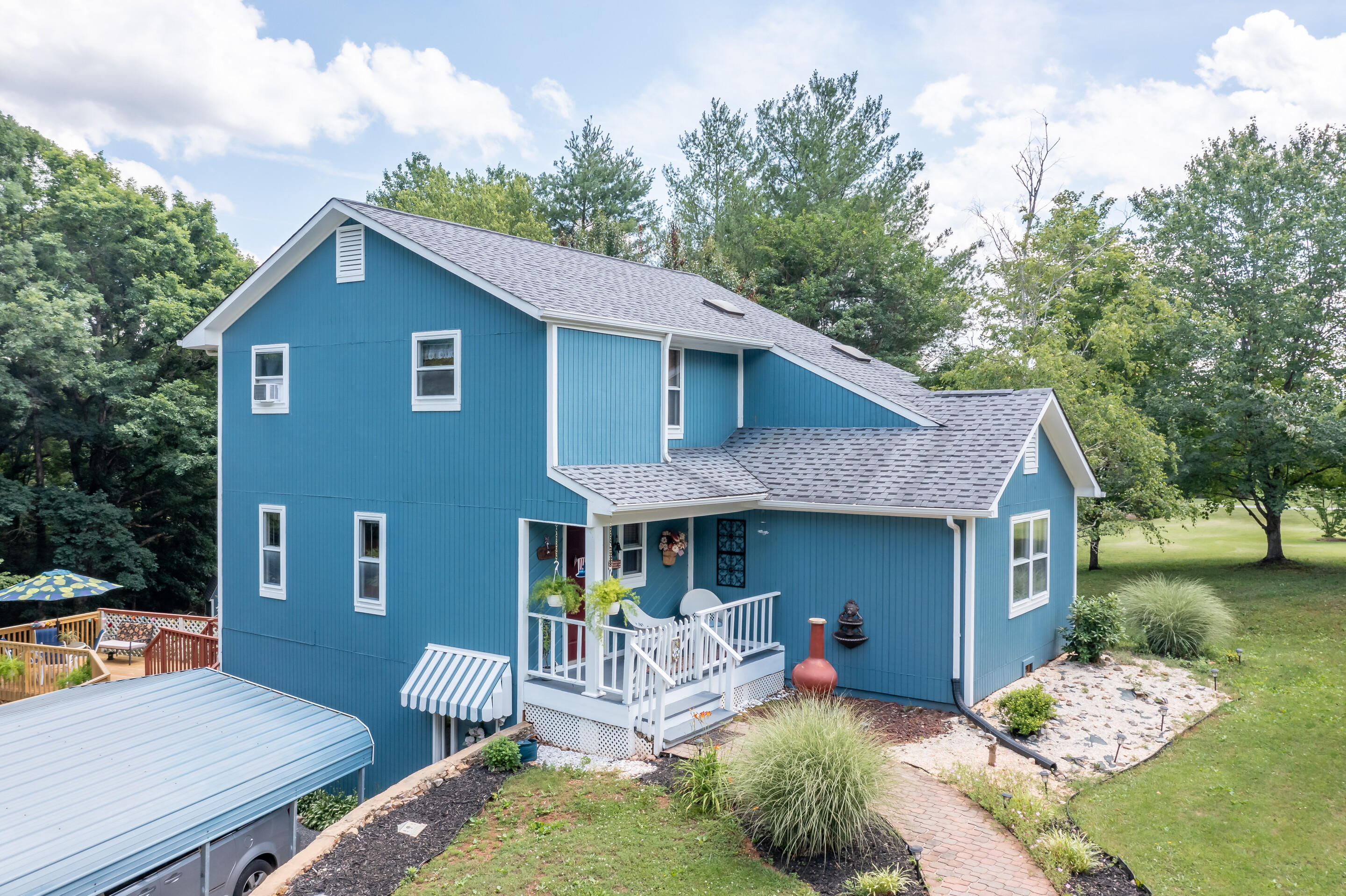1096 Farmington Road Hardy, VA 24101 - Photo 2 of 54 a view of a house with a yard patio and a garden