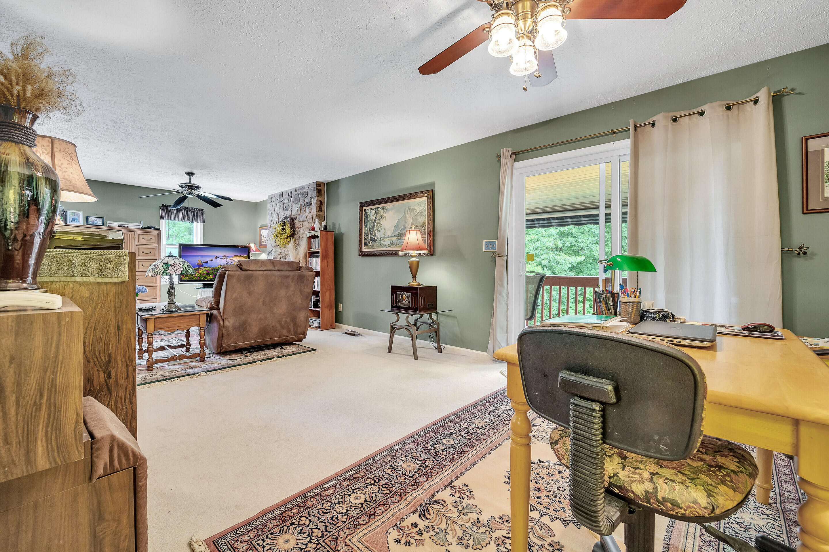 1096 Farmington Road Hardy, VA 24101 - Photo 11 of 54 a work room with furniture a window and a chandelier