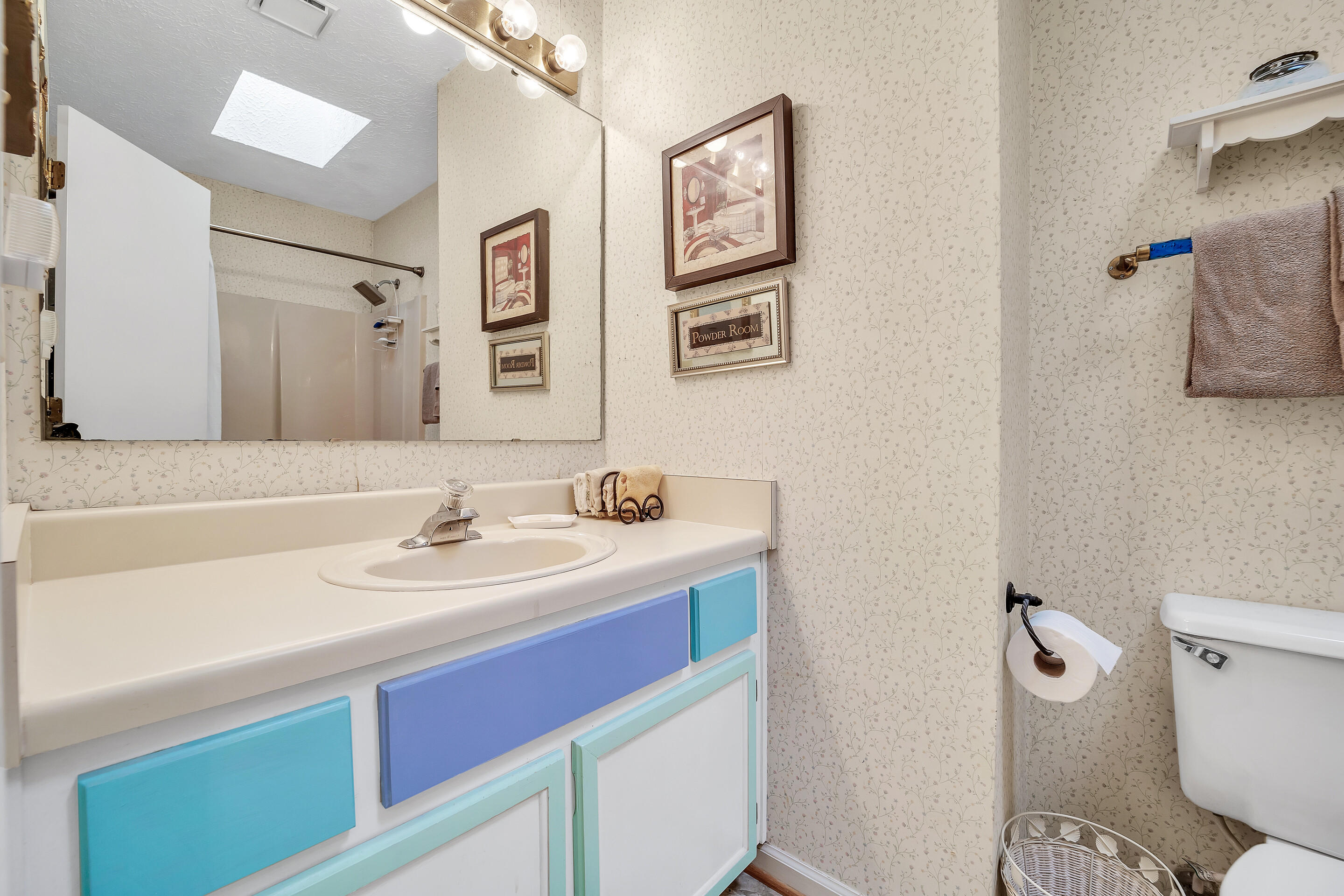 1096 Farmington Road Hardy, VA 24101 - Photo 23 of 54 a bathroom with a sink mirror vanity and toilet