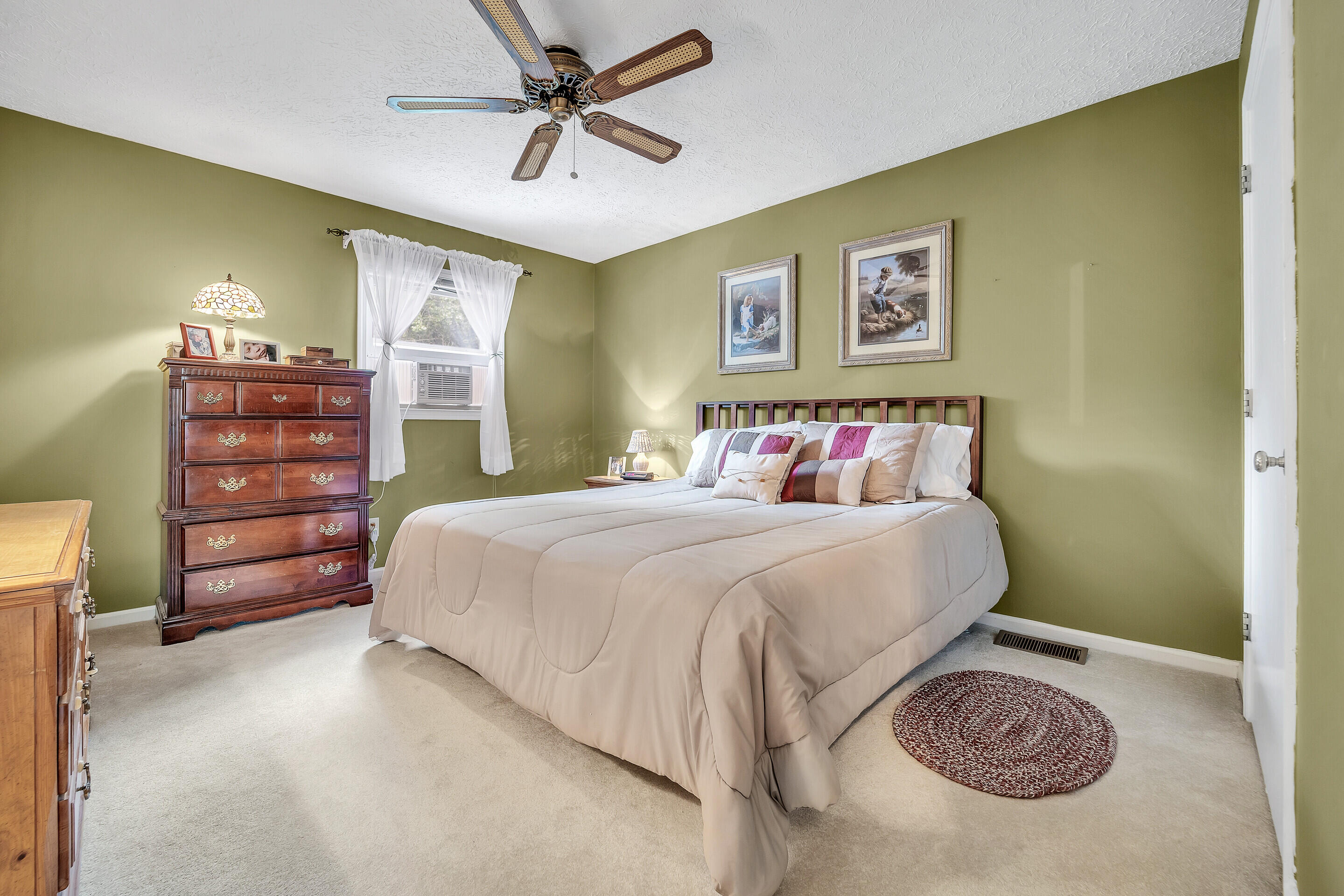 1096 Farmington Road Hardy, VA 24101 - Photo 26 of 54 a bedroom with a bed and a chandelier