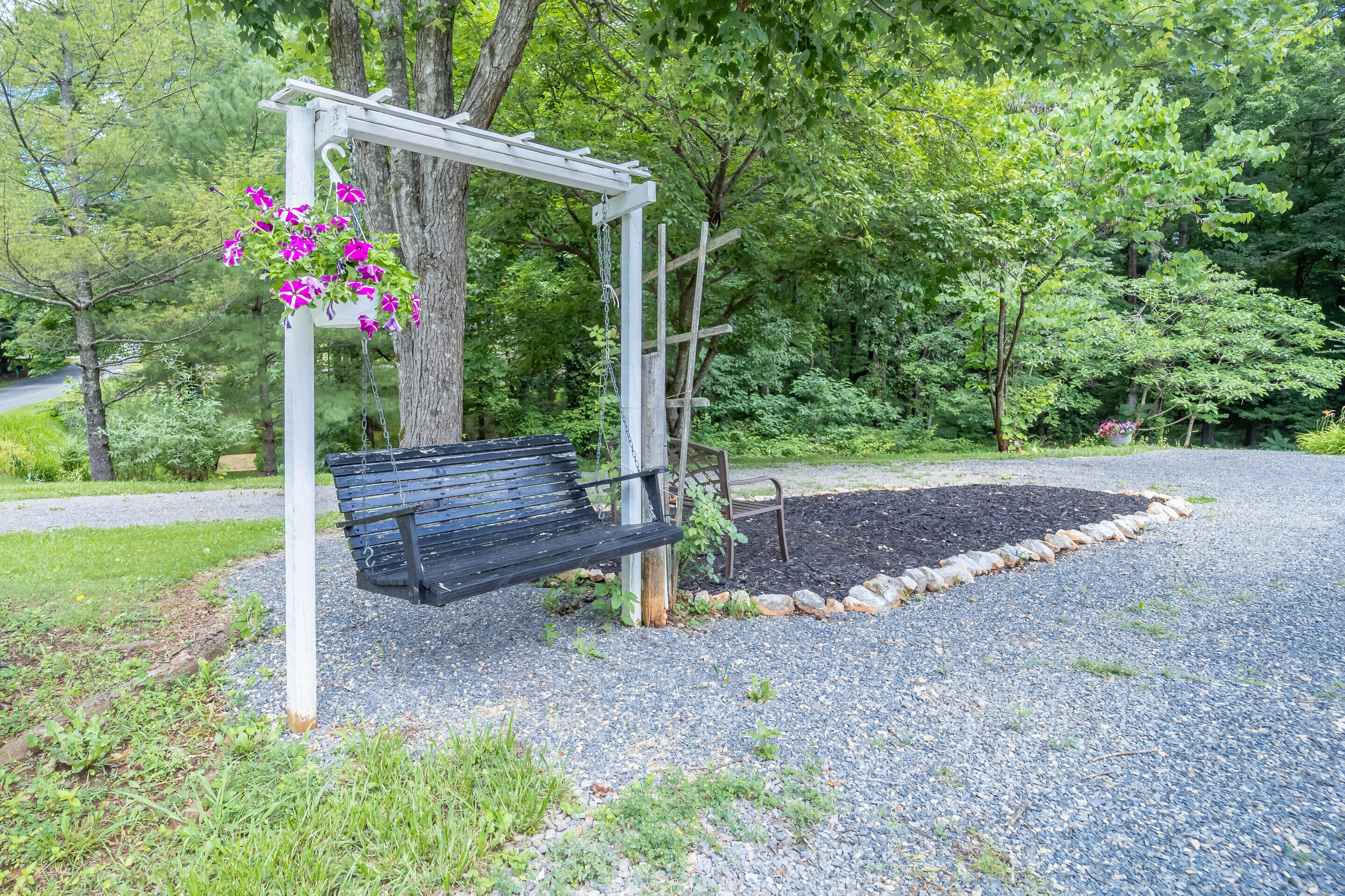 1096 Farmington Road Hardy, VA 24101 - Photo 38 of 54 a view of a backyard with plants and a small yard