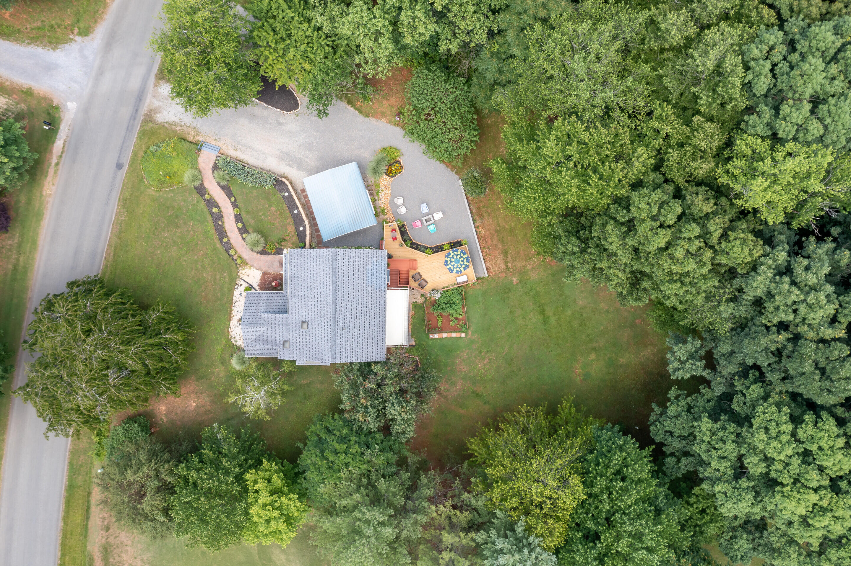 1096 Farmington Road Hardy, VA 24101 - Photo 44 of 54 an aerial view of a house with a yard basket ball court and outdoor seating