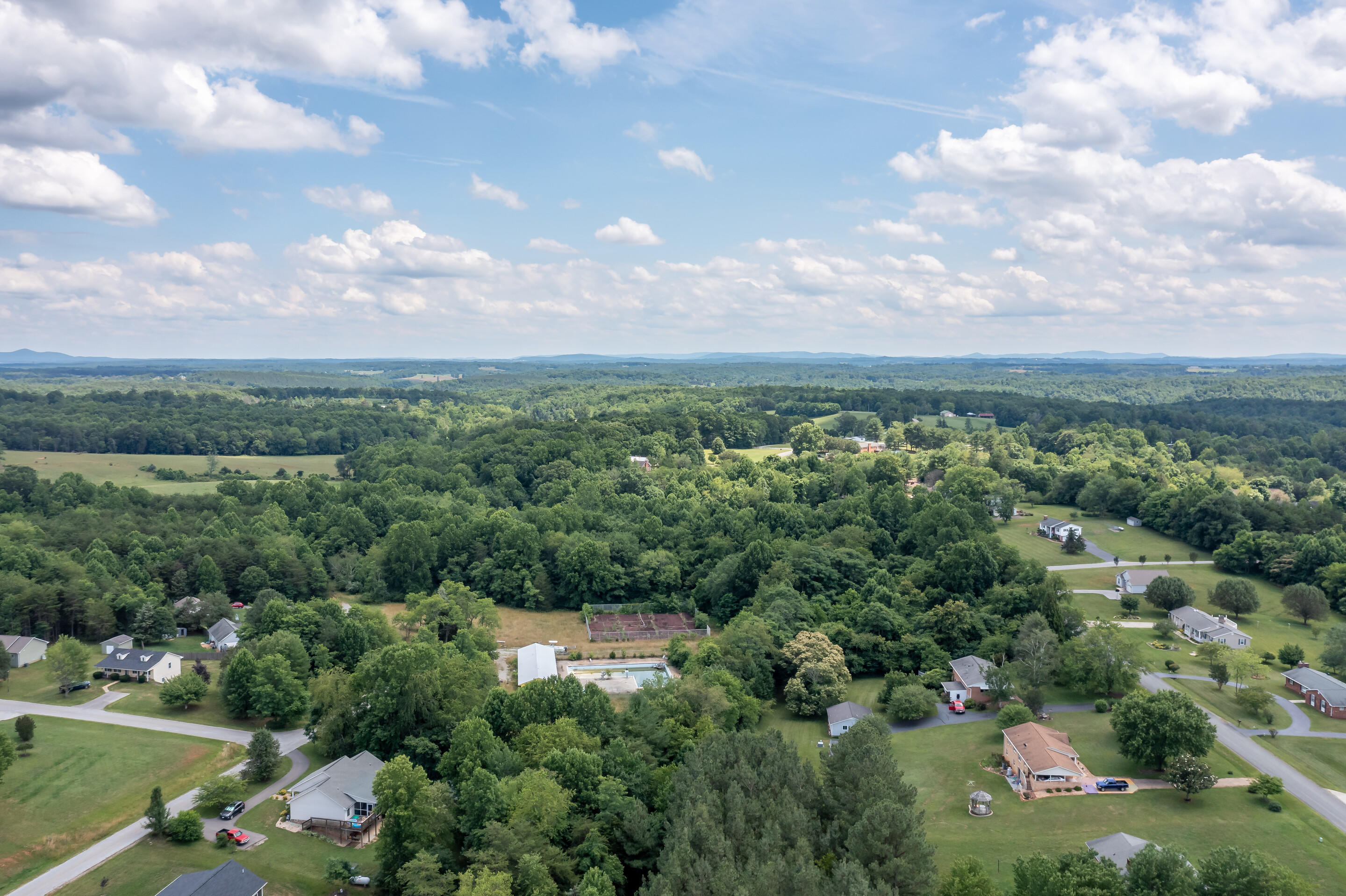 1096 Farmington Road Hardy, VA 24101 - Photo 50 of 54 an aerial view of a city with lots of residential buildings