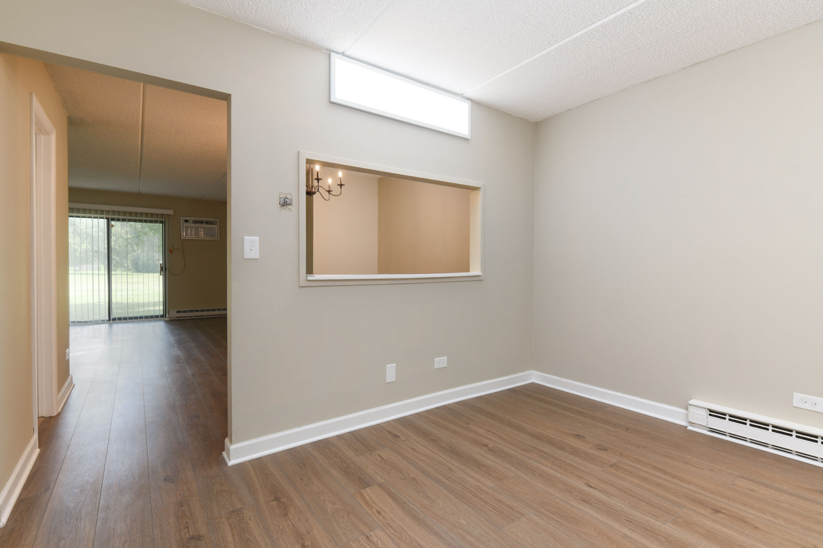 953 North Rohlwing Road, Unit GB Addison, IL 60101 - Photo 13 of 25 a view of an empty room with wooden floor and a window
