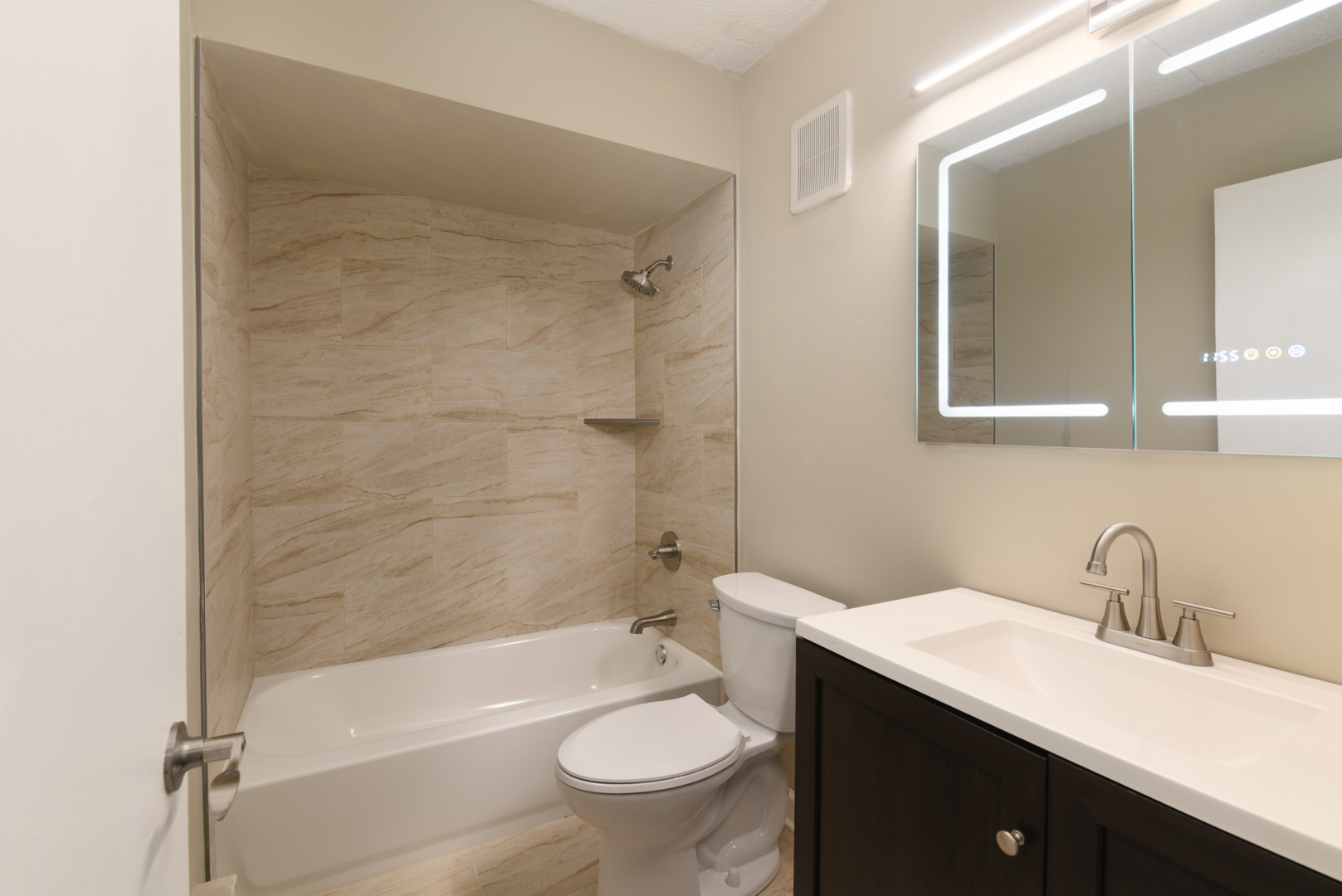 953 North Rohlwing Road, Unit GB Addison, IL 60101 - Photo 21 of 25 a bathroom with a sink a toilet and shower