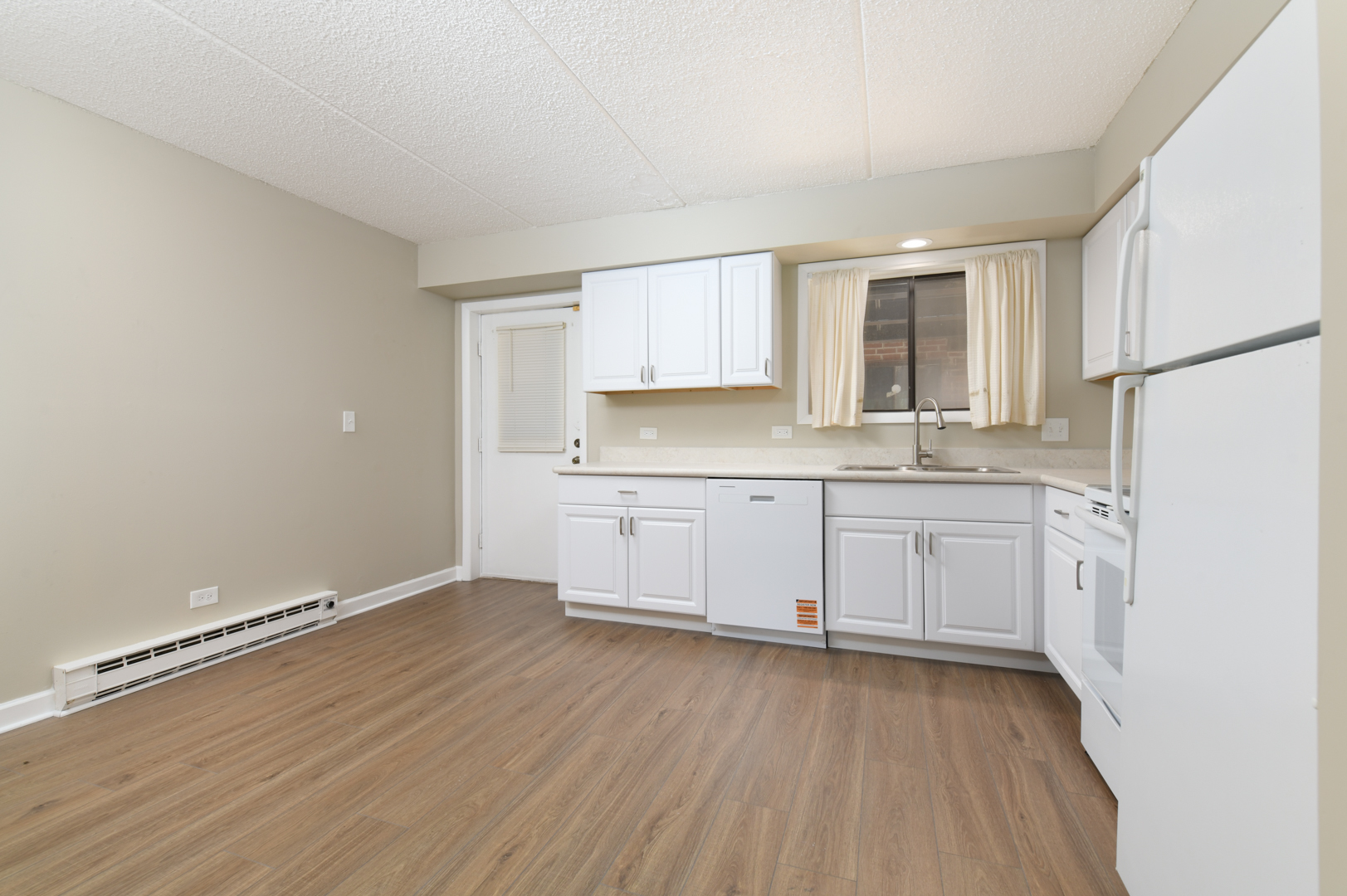953 North Rohlwing Road, Unit GB Addison, IL 60101 - Photo 8 of 25 a kitchen with granite countertop a sink cabinets stainless steel appliances and a window