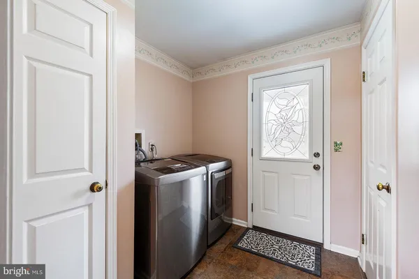 a bathroom with a sink a toilet and shower curtain
