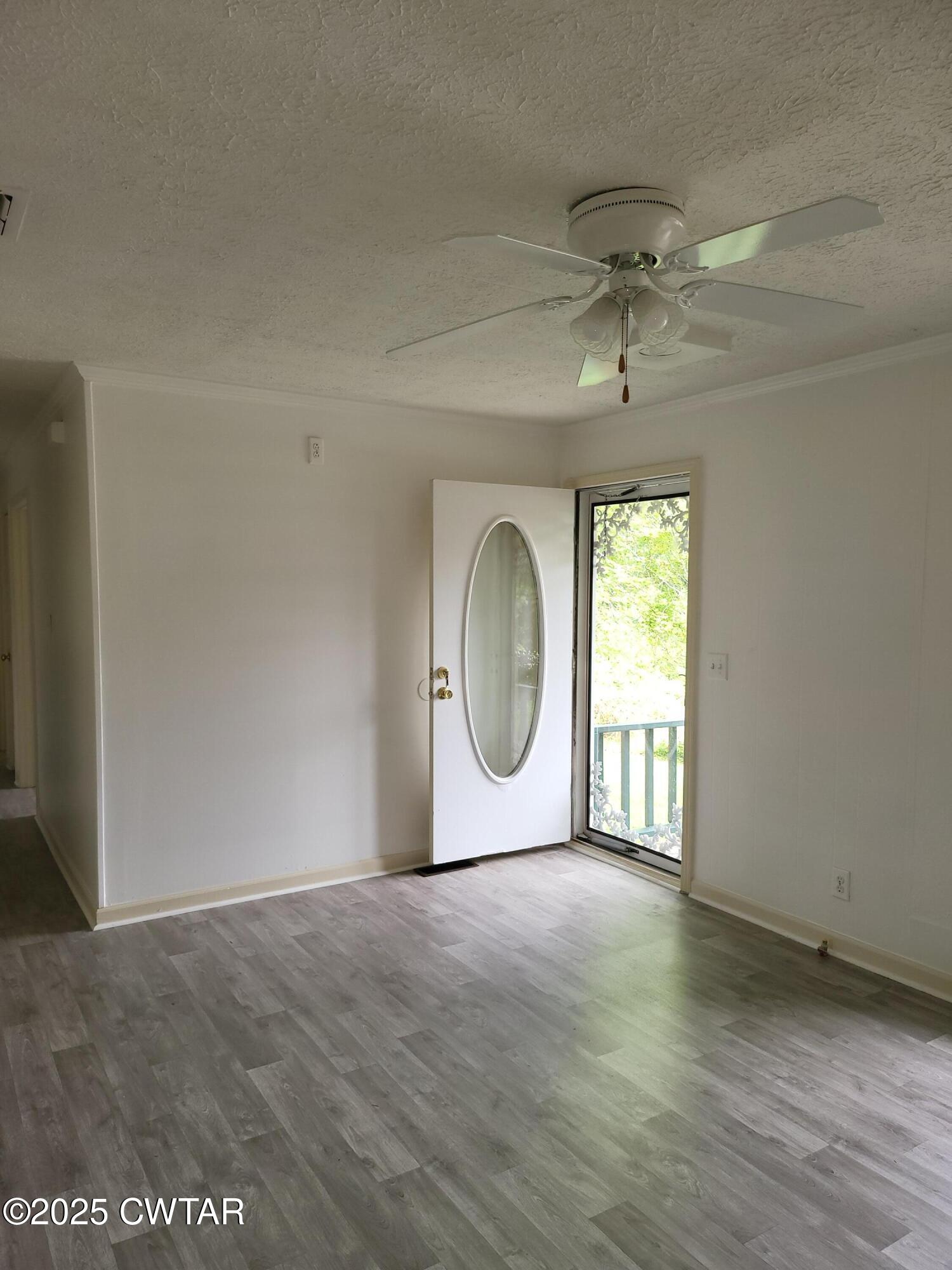 200 Cross Street Bolivar, TN 38008 - Photo 2 of 12 a view of a room with wooden floor and window