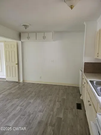 a view of a kitchen with a sink