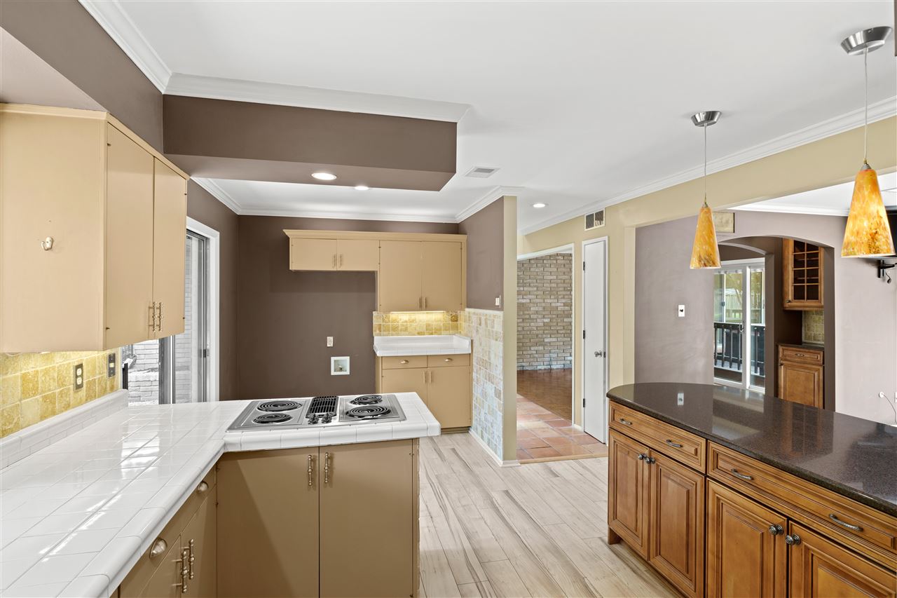 5341 Rich Road Memphis, TN 38120 - Photo 13 of 25 Kitchen features Tile and Granite Counters, Jenn Air Downdraft Electric Cooktop, Stainless Double Oven and Dishwasher