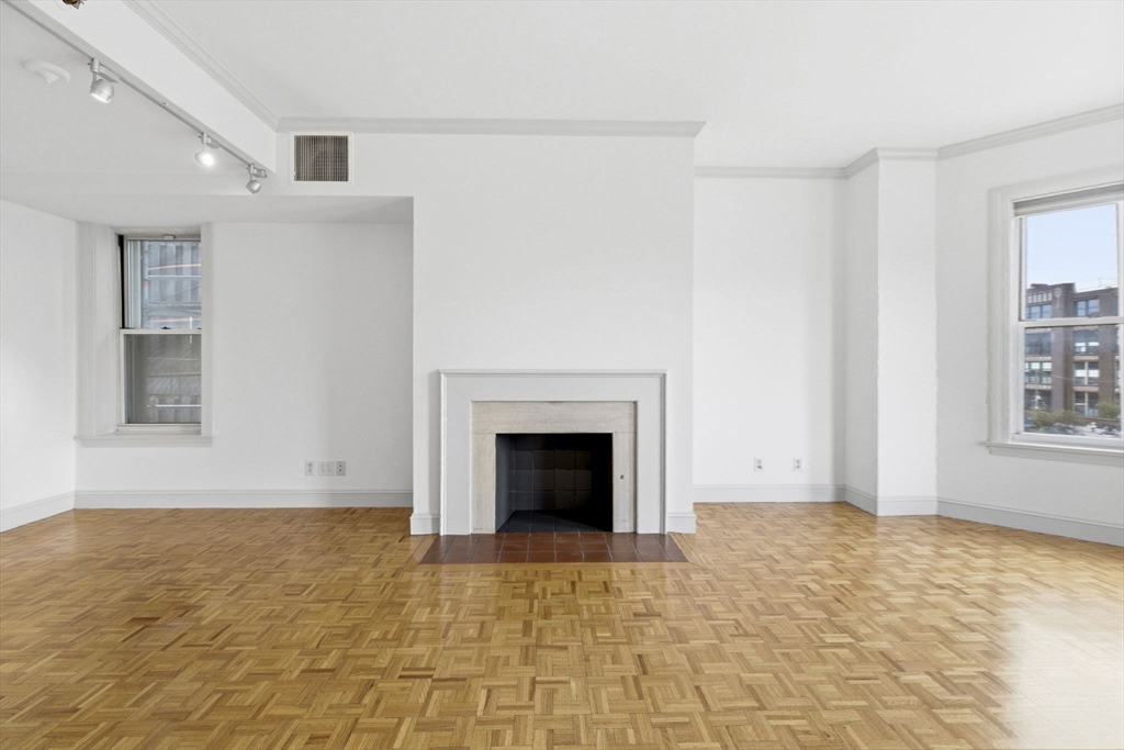 416 Commonwealth Avenue, Unit 312 Boston, MA 02215 - Photo 11 of 24 a view of an empty room with window and fire place