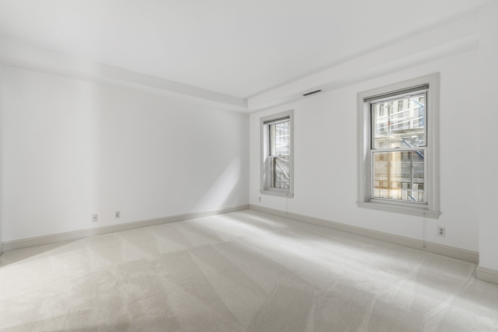 416 Commonwealth Avenue, Unit 312 Boston, MA 02215 - Photo 14 of 24 an empty room with a window