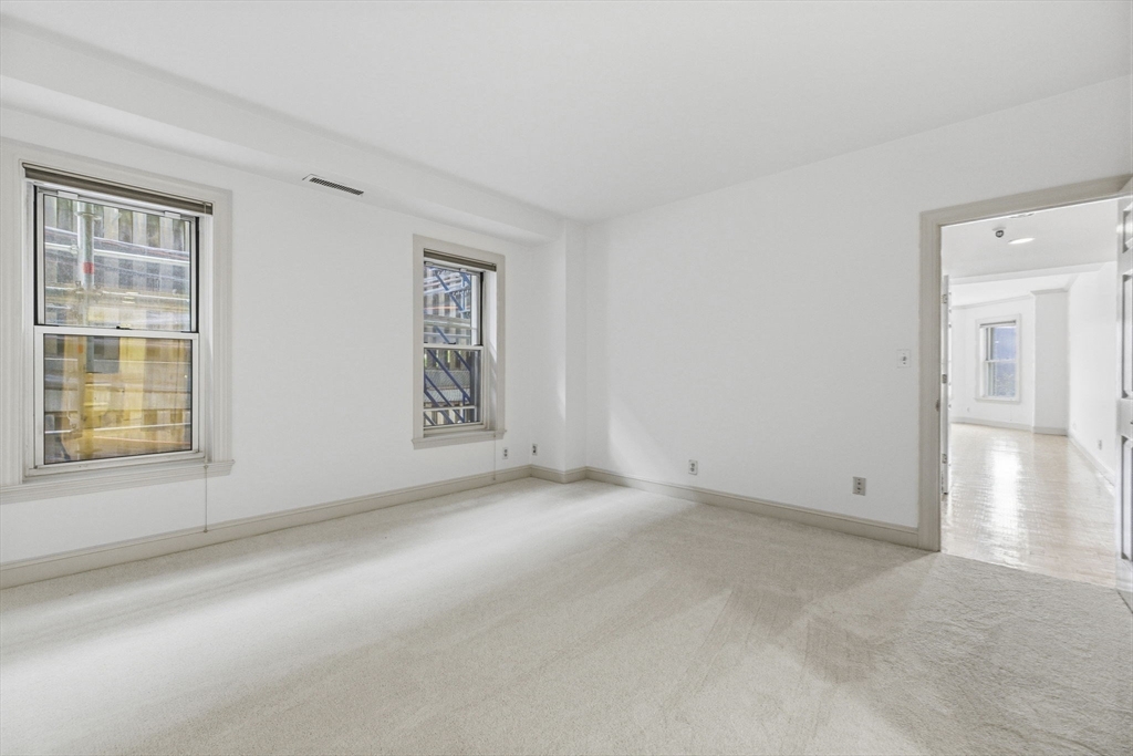 416 Commonwealth Avenue, Unit 312 Boston, MA 02215 - Photo 15 of 24 an empty room with windows