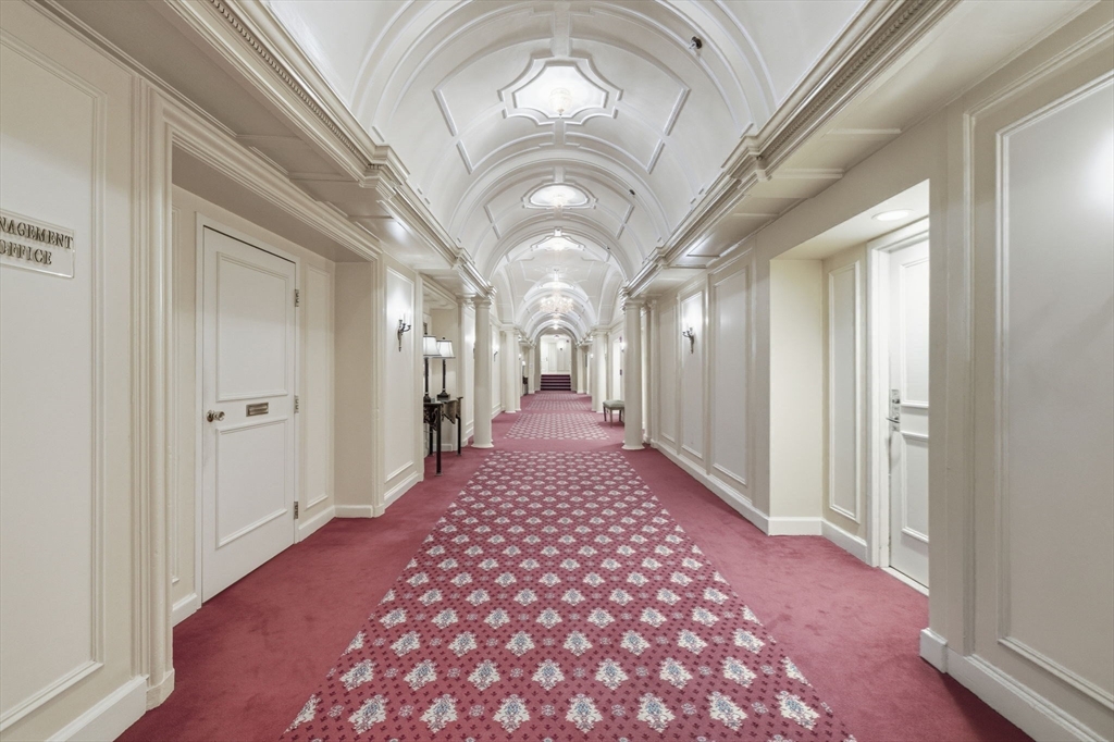 416 Commonwealth Avenue, Unit 312 Boston, MA 02215 - Photo 18 of 24 a very nice looking hallway with a chandelier