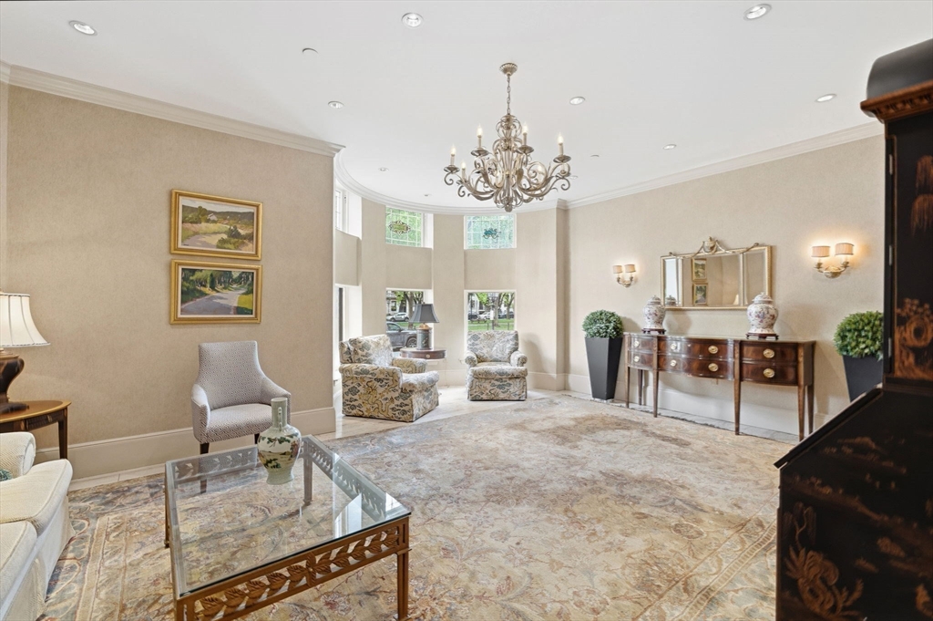 416 Commonwealth Avenue, Unit 312 Boston, MA 02215 - Photo 19 of 24 a living room with furniture a chandelier and a dining table