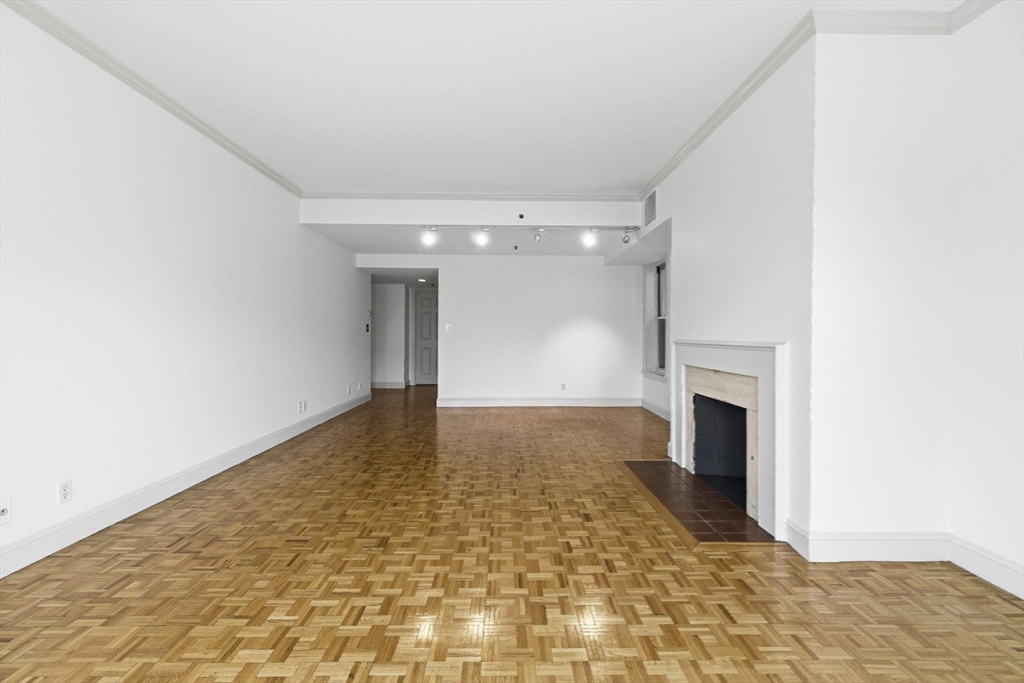 416 Commonwealth Avenue, Unit 312 Boston, MA 02215 - Photo 10 of 24 a view of empty room with a fireplace