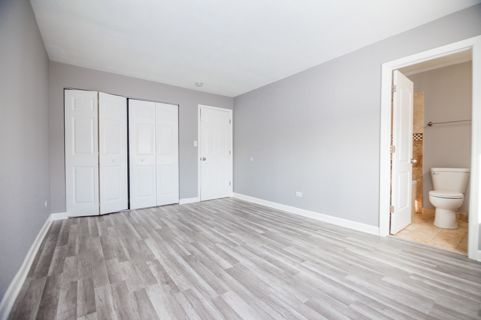 1111 Bloomingdale Road, Unit 2B Glendale Heights, IL 60139 - Photo 11 of 15 a view of an empty room and wooden floor