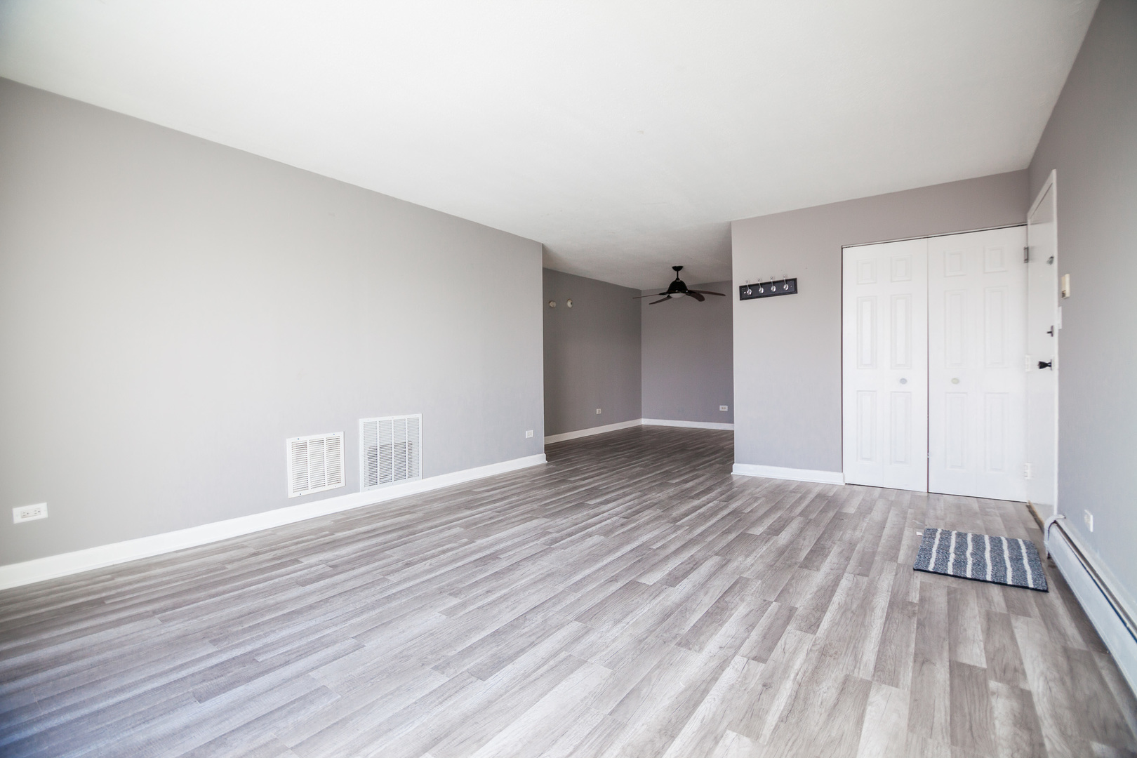 1111 Bloomingdale Road, Unit 2B Glendale Heights, IL 60139 - Photo 2 of 15 wooden floor in an empty room