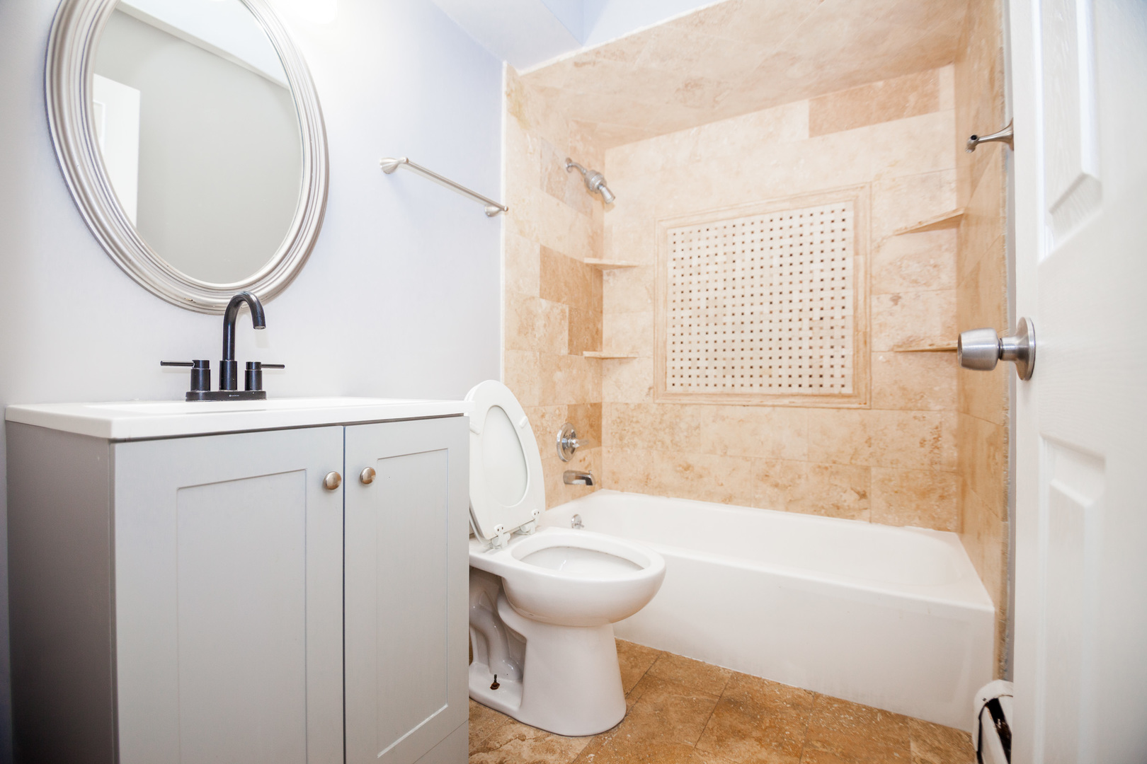 1111 Bloomingdale Road, Unit 2B Glendale Heights, IL 60139 - Photo 9 of 15 a bathroom with a toilet sink and bathtub