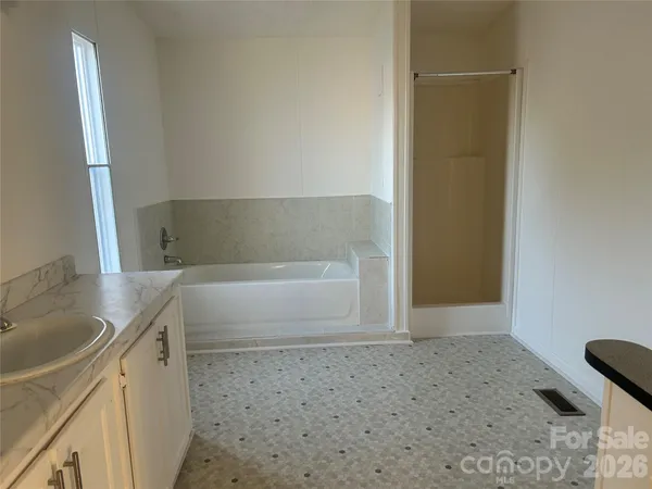 a bathroom with a bathtub and a sink