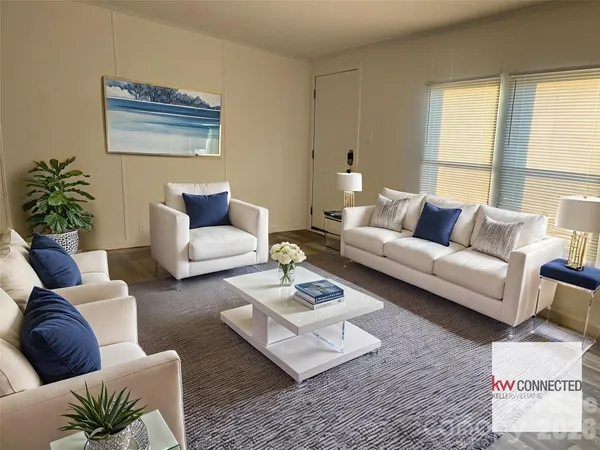 a living room with furniture rug and window