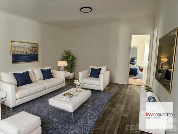 a living room with furniture a rug and a flat screen tv