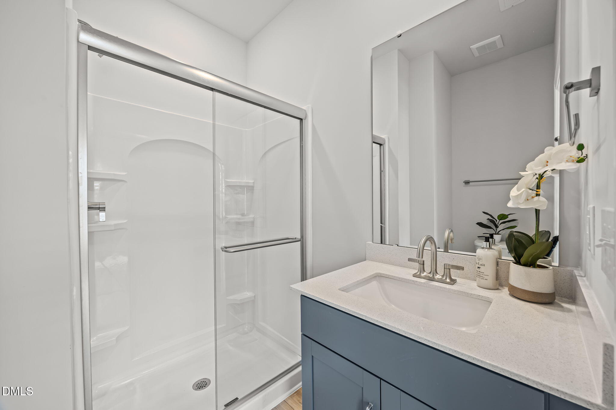 501 Hedrick Ridge Road Cary, NC 27519 - Photo 7 of 47 a bathroom with a sink and a mirror