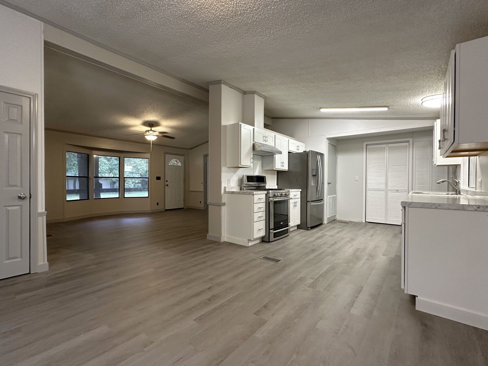 195 Charlies Lane Trinity, TX 75862 - Photo 18 of 25 a view of kitchen with refrigerator and wooden floor