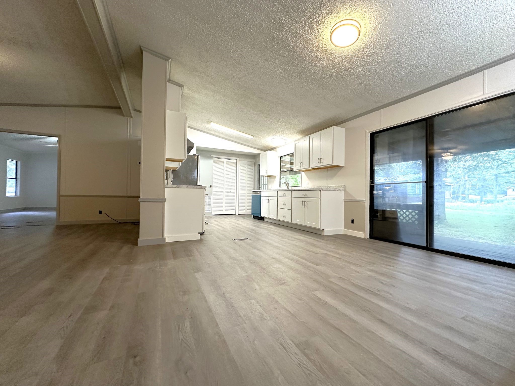 195 Charlies Lane Trinity, TX 75862 - Photo 24 of 25 a view of a kitchen with a sink and a stove top oven