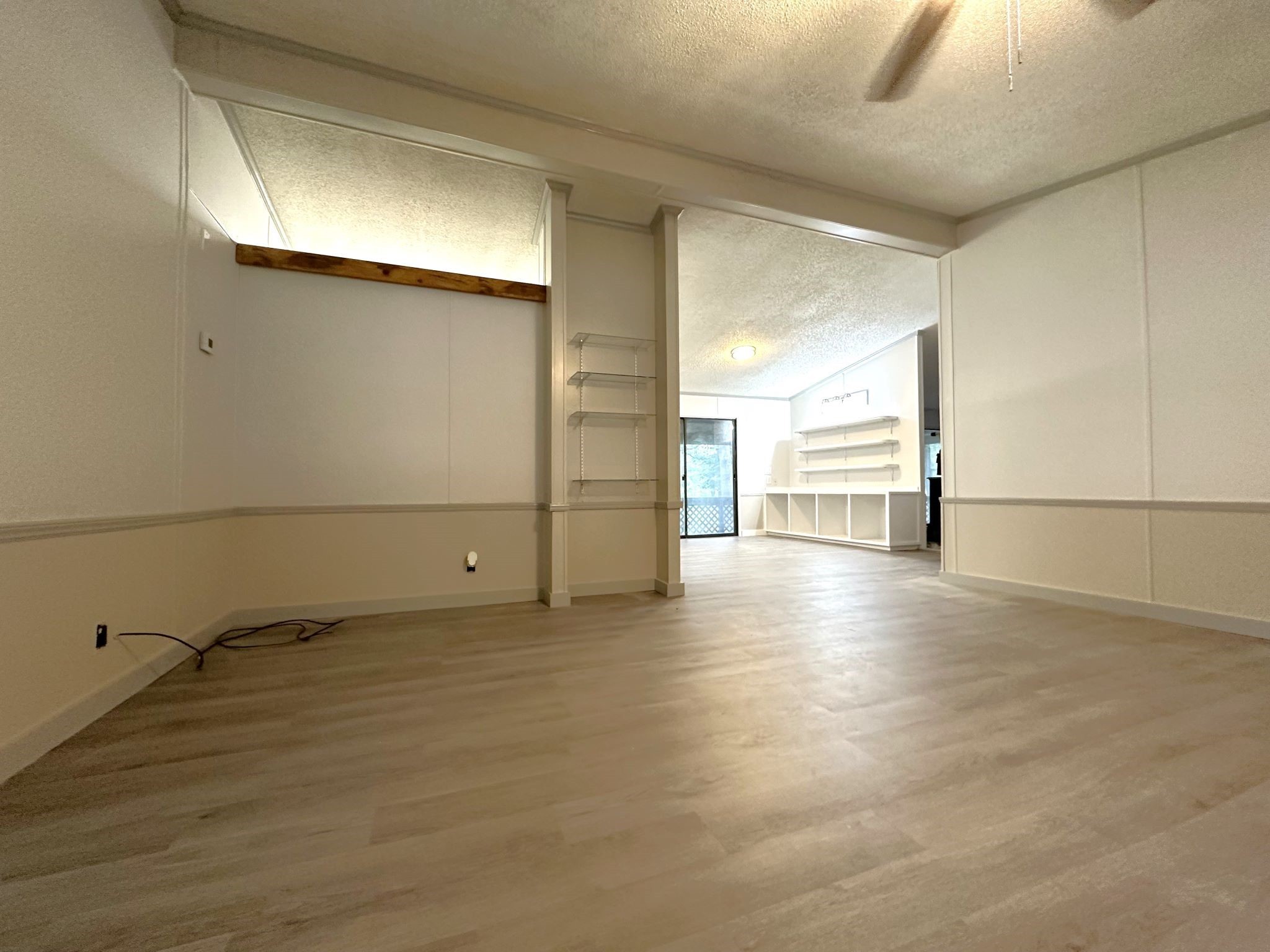 195 Charlies Lane Trinity, TX 75862 - Photo 8 of 25 a view of a livingroom with an empty space and a window
