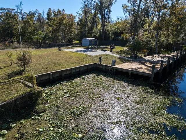 a view of a backyard with sitting area