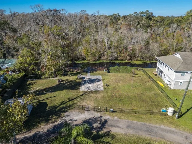 a view of a swimming pool with a yard