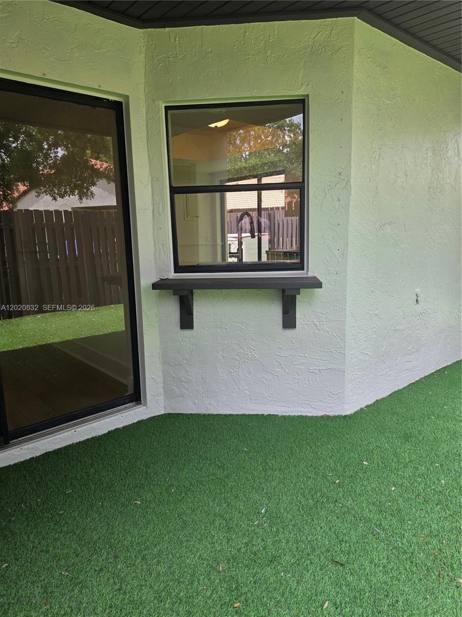 15240 Southwest 45th Terrace, Unit 54F Miami, FL 33185 - Photo 42 of 48 a front view of a house with a yard