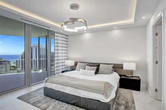 a large white kitchen with a large window