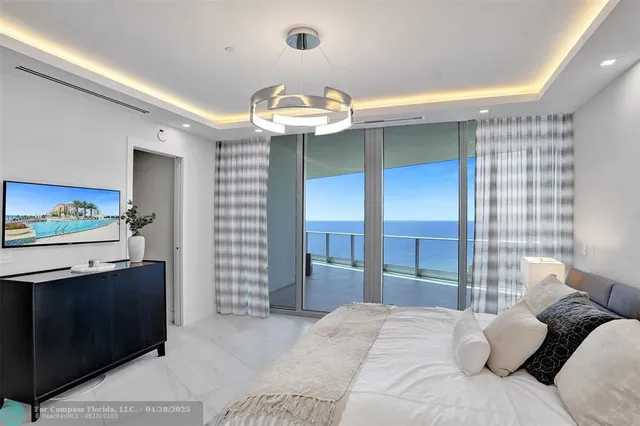 a view of entryway and hall with a front door