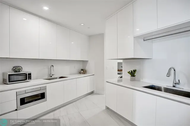 a living room with furniture a large window and a table