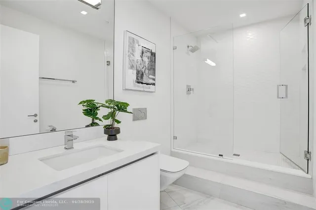 a view of kitchen with furniture and wooden floor