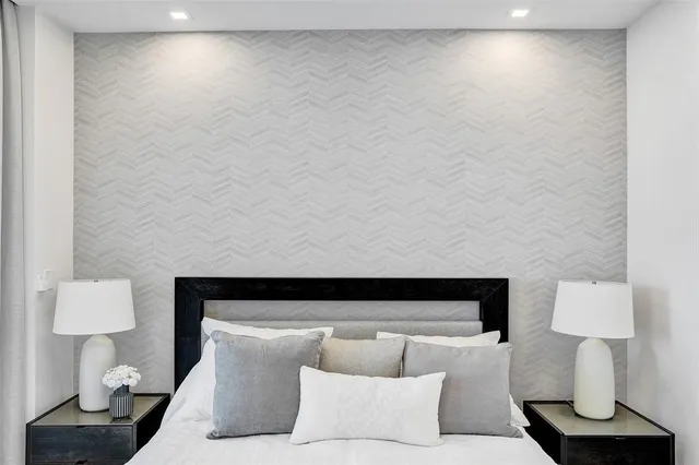 a kitchen with a sink a stove cabinets and stainless steel appliances