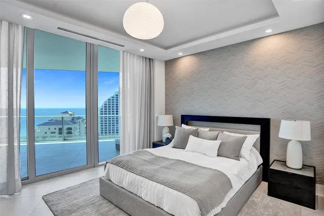 a living room with furniture fireplace and flat screen tv