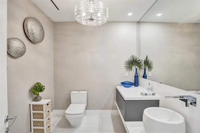 a living room with furniture a rug and a potted plant